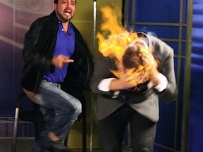 this picture released by American magician Wayne Houchin, Dominican TV presenter Franklin Barazarte, left, reacts as Houchin's head burns while taping "Closer To The Stars" TV program in Santo Domingo, Dominican Republic, Monday, Nov. 26, 2012. Houchin, of Chico, California, is receiving treatment for burns after the incident where Barazarte lit his head on fire with a flammable cologne. (AP Photo)