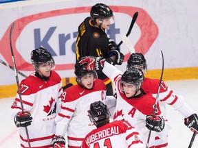 Canada captain Ryan Nugent-Hopkins, centre, celebrates his goal with teammates while playing against Germany during first period IIHF World Junior Championships hockey action in Ufa, Russia on Wednesday, Dec. 26, 2012. (THE CANADIAN PRESS/Nathan Denette)