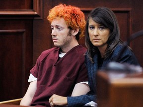 James Holmes (L) makes his first court appearance at the Arapahoe County Courthouse with his public defender Tamara Brady on July 23, 2012 in Centennial, Colorado. According to police, Holmes killed 12 people and injured 58 others during a shooting rampage at an opening night screening of "The Dark Knight Rises" July 20, in Aurora, Colorado.  (Photo by RJ Sangosti-Pool/Getty Images)