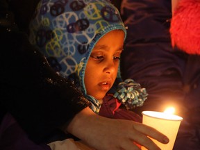 Friends, colleagues and supporters attend a vigil in memory of six year-old, Ana Marquez-Greene, a victim of last Fridays mass shooting in Newtown, Conn., on Monday December 17, 2012. The vigil was held at the University of Winnipeg, where Ana's mother had previously worked as a licensed therapist. THE CANADIAN PRESS/Trevor Hagan