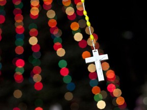 A cross is seen at a memorial for the victims of the Sandy Hook Elementary School shooting December 19, 2012 in Newtown, Connecticut. Six victims of the Newtown school shooting are being honored at funerals and visitations across the state today for the victims of Sandy Hook Elementary School. (Photo by Allison Joyce/Getty Images)