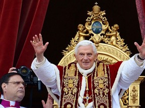 Pope Benedict XVI delivers his traditional Christmas “Urbi et Orbi” blessing from the balcony of St. Peter’s Basilica at the Vatican on December 25, 2012.
Photograph by: VINCENZO PINTO , AFP/Getty Images