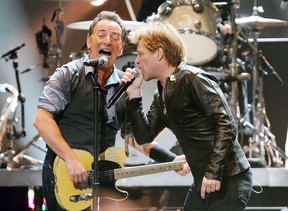 This image released by Starpix shows Bruce Springsteen, left, and Jon Bon Jovi performing at the 12-12-12 The Concert for Sandy Relief at Madison Square Garden in New York on Wednesday, Dec. 12, 2012. Proceeds from the show will be distributed through the Robin Hood Foundation. (AP Photo/Starpix, Dave Allocca)
