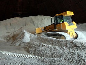 In this file photo, a bulldozer pushes salt in a silo at the Crawford Avenue yard in Windsor, Ont. on Thursday, December 27, 2012.        (TYLER BROWNBRIDGE / The Windsor Star)