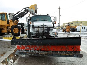 A front end loader fills a salt truck at the Crawford Avenue yard in Windsor, Ont. on Thursday, December 27, 2012. Snow removal crews worked though the night to clear the streets for the morning commuters.        (TYLER BROWNBRIDGE / The Windsor Star)