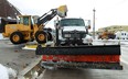 A front end loader fills a salt truck at the Crawford Avenue yard in Windsor, Ont. on Thursday, December 27, 2012. Snow removal crews worked though the night to clear the streets for the morning commuters.        (TYLER BROWNBRIDGE / The Windsor Star)