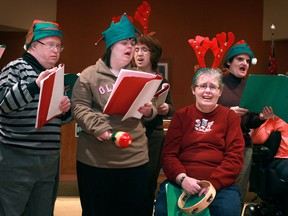 A choir group from Harmony in Action, a not for profit group for adults with physical or developmental difficulties, sing Christmas carols at the Greater Essex County District School Board Administration Office, Wednesday, Dec. 19, 2012.  (DAX MELMER/The Windsor Star)