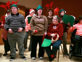 A choir group from Harmony in Action, a not for profit group for adults with physical or developmental difficulties, sing Christmas carols at the Greater Essex County District School Board Administration Office, Wednesday, Dec. 19, 2012.  (DAX MELMER/The Windsor Star)