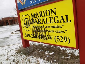 Paint covers the Marion Paralegal sign at Place Concord in Windsor, Ont. on Wednesday, December 26, 2012.         (TYLER BROWNBRIDGE / The Windsor Star)