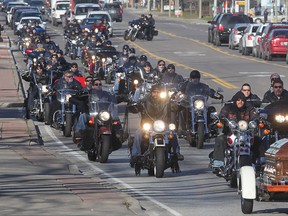A large procession of riders on rumbling motorcycles paid their final respects Thursday to William (Billy) Pich. Pich was known for his participation in charity rides and he was carried to Heavenly Rest Cemetery on the sidecar of a motorcycle. (Dan Janisse/The Windsor Star)