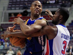 Detroit Pistons guard Rodney Stuckey (3) knocks the ball away from Golden State Warriors guard Jarrett Jack during the first quarter of an NBA basketball game at the Palace of Auburn Hills, Mich., Wednesday, Dec. 5, 2012. (AP Photo/Carlos Osorio)