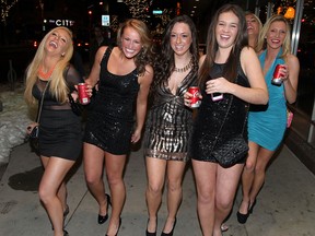 Mollie Bertsch, left, Emily Kiger, Annie Fortuna, Brooke Collins, Alyssa Armiak and Taylor Trzeciak, right, head for their New Year's Eve party in downtown Windsor around 9 PM December 31, 2012. ( NICK BRANCACCIO/The Windsor Star)