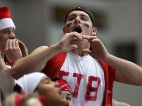 F. J. Brennan supporter and member of the Red Nation, Michael Hugall cheers as his Cardinals had a commanding lead over the St. Joseph's Lasers during the 2012 Father Zakoor Cup at WFCU Centre, Thursday December 20, 2012. (NICK BRANCACCIO/The Windsor Star)