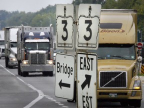 A line of trucks roll down Talbot road between Howard avenue and Cousineau Road near St. Clair College. (Windsor Star files)