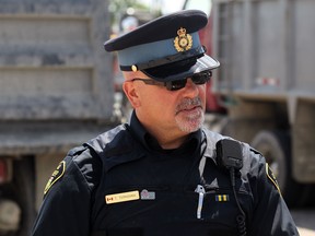 Files: OPP Const. Todd Ternovan during a joint-forces truck safety initiative involving the OPP, Ministry of Transportation and Ministry of Revenue  on June 26, 2012. (NICK BRANCACCIO/The Windsor Star)