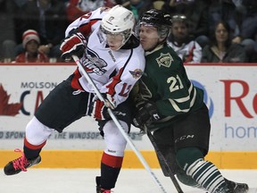 Spitfires forward Ben Johnson, left, battles London's Tyler Ferry at the WFCU Centre. (DAN JANISSE/The Windsor Star)