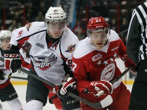 Windsor Spitfires Brady Vail battles with Sault Ste. Marie Greyhounds Nick Cousins during the Ontario Hockey League game at the WFCU Centre in Windsor, Ontario on December 6, 2012.  (JASON KRYK/ The Windsor Star)