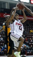 Windsor Express point guard Darren Duncan, centre, is covered by London's Jeremy Williams at the WFCU Centre Saturday. (JASON PRUPAS/Special to The Star)