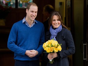 Britain's Prince William, the Duke of Cambridge, (L) poses for pictures with his wife Catherine, Duchess of Cambridge, as they leave the King Edward VII hospital in central London, on Dec. 6, 2012. Prince William's pregnant wife Catherine left a London hospital on Thursday, four days after she was admitted for treatment for acute morning sickness. AFP PHOTO/Leon NealLEON NEAL/AFP/Getty Images