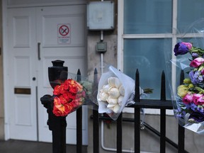 Bunches of flowers are left outside the nurses accommodation block near the King Edward VII hospital in central London on December 9, 2012 in memory of Indian-origin nurse Jacintha Saldanha who was found dead two days ago.  A nurse at the hospital which treated Prince William's pregnant wife Catherine, Duchess of Cambridge, was found dead on December 7, days after being duped by a hoax call from an Australian radio station, the hospital said. Police said they were treating the death, which happened at a property near the hospital, as unexplained. AFP PHOTO / CARL COURTCARL COURT/AFP/Getty Images