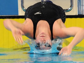 Kira Toussaint of Netherlands competes in the women 100m backstroke semifinal at the FINA World Short Course Swimming Championships on December 12, 2012 in Istanbul. AFP PHOTO/BULENT KILICBULENT KILIC/AFP/Getty Image