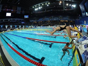 A swimmer dives in the pool during a training session Friday at the FINA World Short Course Swimming Championships in Istanbul. AFP PHOTO/MIRAMIRA/AFP/Getty Images