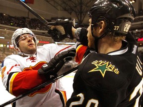 Ex-Spitfire Steve Ott, right, is checked by Calgary's Lee Stempniak in Dallas last year. (Louis DeLuca/Dallas Morning News/MCT)