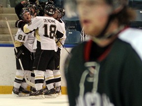 The LaSalle Vipers celebrate their overtime goal against the St. Marys Lincolns at the Vollmer Centre Wednesday.  (JASON KRYK/The Windsor Star)