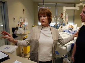 Lisa Anne Dauncey's mother, Pam Berthiaume, left, and Jaime Dauncey, Lisa's sister, visit with Lisa Anne Dauncey, behind, at Hotel-Dieu Grace Hospital Thursday February 18, 2010.  Lisa Anne is recovering from serious injuries suffered in a car crash recently.  (NICK BRANCACCIO/The Windsor Star)