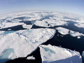 In this file photo, ice floes float in Baffin Bay above the Arctic circle as seen from the Canadian Coast Guard icebreaker Louis S. St-Laurent on July 10, 2008. A record loss of Arctic sea ice and faster-than-expected melting of Greenland's ice cap made worldwide headlines in 2012, but research published in major science journals in the fall suggest warming in the North doesn't have to continue. We could refreeze the Arctic, proposed a paper in Nature Climate Change. It wouldn't even cost that much, said an affiliated study in Environmental Research Letters. The question is should we? THE CANADIAN PRESS/Jonathan Hayward