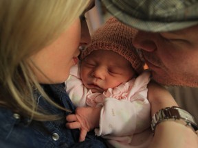 Leanne and Joe Tedesco hold their newborn baby Lia at Windsor Regional Hospital on December 18, 2012 in Windsor, Ontario.  See story on baby names by Ted Whipp. (JASON KRYK/ The Windsor Star)