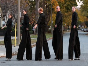 Stilt Guys Lindsay Bellaire, left, Phillip Psutka, Clinton Hammond, Mark Lefebvre and Kyle Sipkens, right, go for a walk in Walkerville where they attended a party at Walkerville Brewery celebrating their appearance on Dragon's Den October 24, 2012.  Dragon's Den aired on television starting at 8 PM. (NICK BRANCACCIO/The Windsor Star)