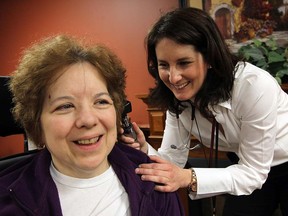 File Photo: Nurse practitioner Shauna Carter examines Cathy Squizzato,left, at the Village of Aspen Lakes.                (TYLER BROWNBRIDGE / The Windsor Star)