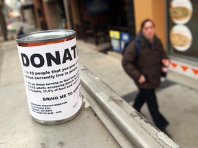 WINDSOR, ON: DECEMBER 6, 2012 -- A can is seen on a ledge in downtown Windsor on Thursday, December 6, 2012. The cans popped up on Wednesday with a label asking those who find them to donate them to someone in need.            (TYLER BROWNBRIDGE / The Windsor Star)