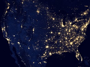 In this image provided by NASA, the United States of America is seen at night from a composite assembled from data acquired by the Suomi NPP satellite in April and October 2012. The image was made possible by the new satellite’s “day-night band” of the Visible Infrared Imaging Radiometer Suite (VIIRS), which detects light in a range of wavelengths from green to near-infrared and uses filtering techniques to observe dim signals such as city lights, gas flares, auroras, wildfires, and reflected moonlight. (AP Photo/NASA)
