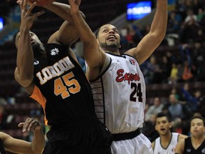 Express forward Anthony Johnson, right, battles for a rebound with London Lightning forward Marvin Phillips during first half NBL basketball action against at the WFCU Centre in Windsor, Ontario on December 21, 2012. (JASON KRYK/The Windsor Star)