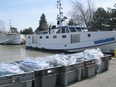 In this file photo, fishing nets sit beside boats at the Wheatley harbour  March 31, 2010. Windsor Star files)