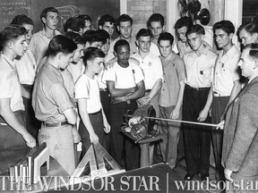 Aug.13/1946-Mr. Charles Moncrier, assstant supervisor of apprentices at the Ford of Canada Trade School explains some of the mechanics of a gear box.