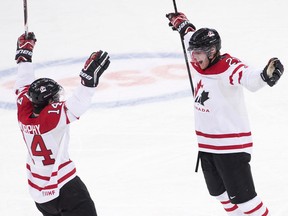 Team Canada defenceman Dougie Hamilton, right, reacts with teammate Ryan Murphy, left, after scoring a goal while playing against Russia during first period IIHF World Junior Championships hockey action in Ufa, Russia on Monday, Dec. 31, 2012. THE CANADIAN PRESS/Nathan Denette