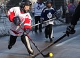 Alex Cunningham, 9, left, represents the Red Wings in a scrimmage game of ball hockey at the Windsor Classic on Riverside Drive west in downtown Windsor, Friday, Dec. 28, 2012. (DAX MELMER / The Windsor Star)