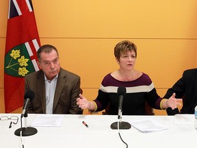 Dave Cooke, Teresa Piruzza and Tom Porter (left to right) take part in a press conference to announce their findings on a super hospital.  (TYLER BROWNBRIDGE / The Windsor Star)