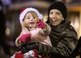 Scotlynn McCormick, left, and Hollie Menard enjoy the 2012 Essex Santa Claus Parade on Talbot Street North Saturday, Dec. 8, 2012.          (KRISTIE PEARCE/ The Windsor Star)