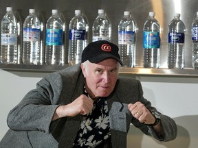 File photo of Iain Baxter& posing in front of his 'Waterworks' exhibit at the Art Gallery of Windsor on June 13, 2003. (Windsor Star files)