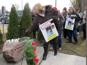 About 40 residents mourned Thursday outside of the Chrysler plant the memory of women lost to violence. Thursday marked the 23rd anniversary of the massacre at Ecole Polytechnique in Montreal. Attendees also honoured the memories of MaryLou, a Chrysler worker killed by her husband in 1989, and Lori Dupont, slain by a former boyfriend at Hotel-Dieu Grace Hospital in 2005.      (MONICA WOLFSON / The Windsor Star)