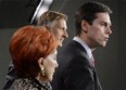 Conservative MP Russ Hiebert, right, speaks about his Private Members Bill, C-377, regarding financial transparency for labour organizations during a news conference on Parliament Hill in Ottawa on Thursday, Dec.13, 2012. THE CANADIAN PRESS/Adrian Wyld