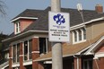 A Neighbourhood Watch Windsor sign is displayed on Hall Avenue in Windsor.  (JASON KRYK/ The Windsor Star)