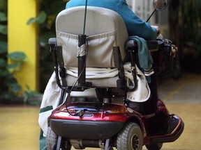 A senior in a motorized wheelchair. (Postmedia News files)
