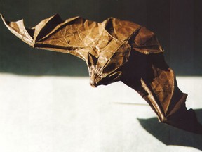 This undated photo courtesy of Origamido in Haverhill, Mass., shows the Big Brown Bat designed by Michael G. LaFosse. He folded the bat from a 12-inch square piece of paper. (AP Photo/Origamido)