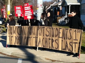 Teachers gather at the corner of Jefferson Boulevard and Raymond Avenue on Dec. 12, 2012 to protest Bill 115. (NICK BRANCACCIO/The Windsor Star)