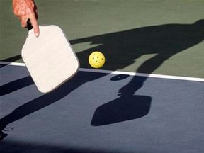 In this Dec. 3, 2012 photo, Del Teter competes in a game of pickleball at Sun City West senior community in Surprise, Ariz. (AP Photo/Matt York)